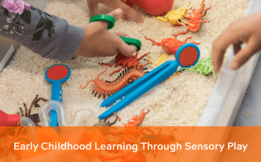 Children playing with rice sensory bin using toy insects and scooping tools