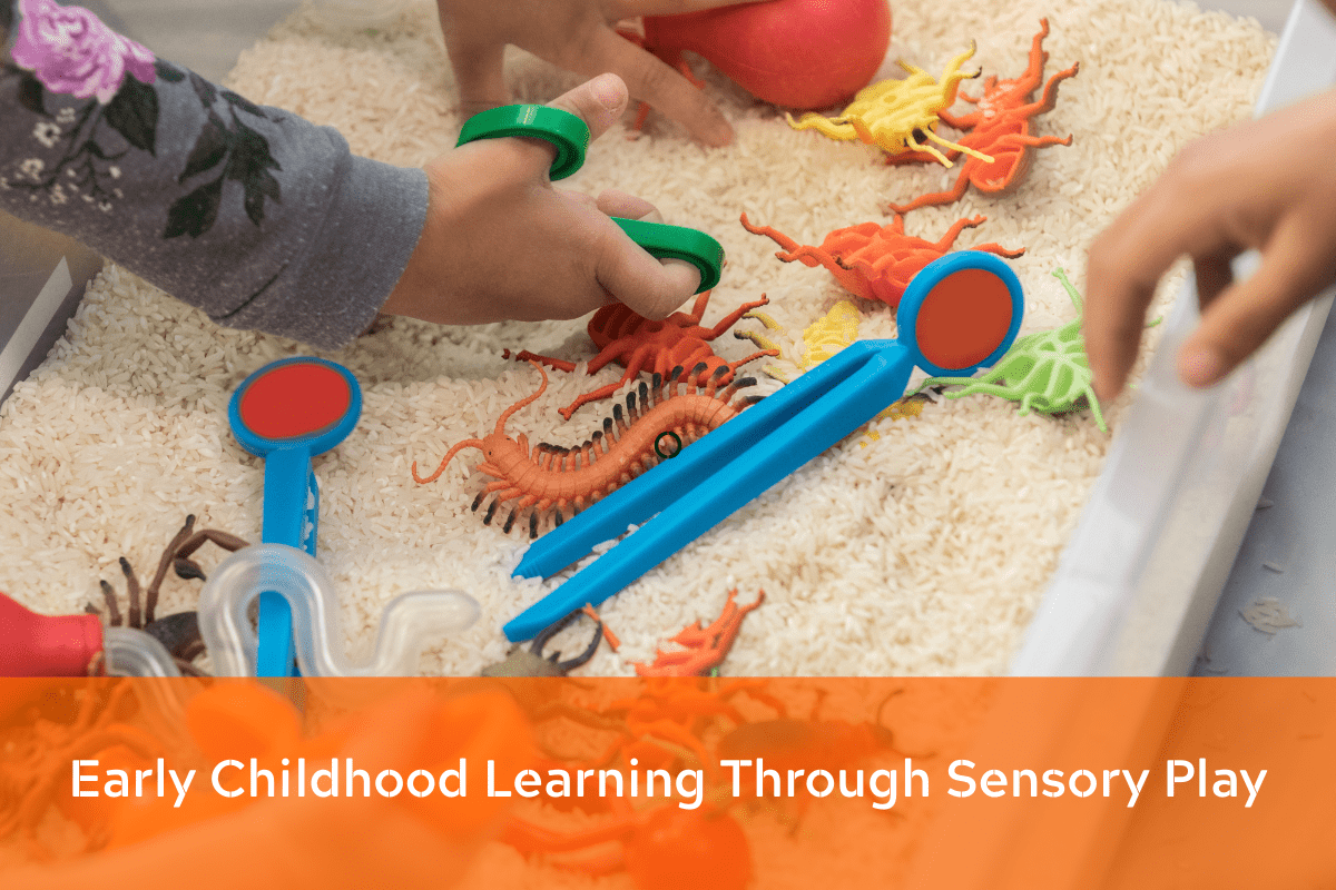 Children playing with rice sensory bin using toy insects and scooping tools
